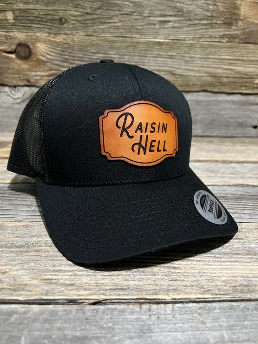 Raisin Hell Leather Patch Trucker Hat - Savannah Moss Co.